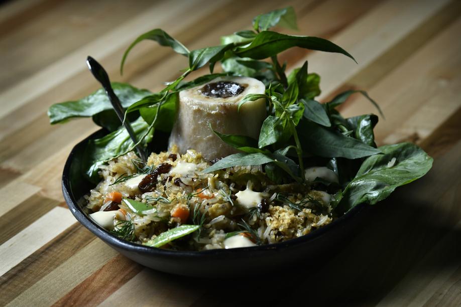 Nightshade Noodle Bar signature dishes Nightshade Lemongrass Fried Chicken, Clams Casino, Bone Marrow Fried Rice, and various handmade noodle dishes.